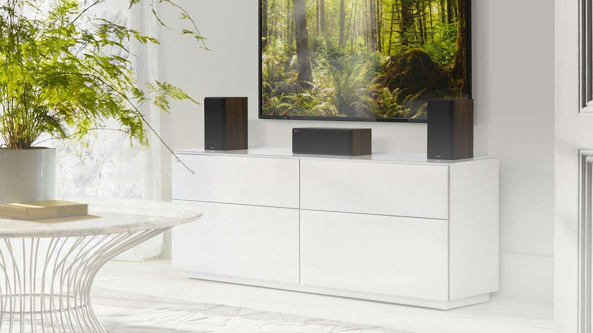 RP 500 C II center channel speaker with RP 500 M II on a grey white credenza